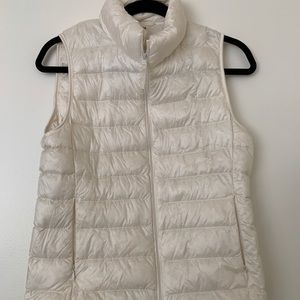 This is a white/creme vest